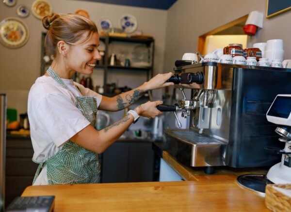Barista at Work Skillfully Crafting the Perfect Coffee Experience in a Warm, Cozy Cafe Barista at Work Skillfully Crafting the Perfect Coffee Experience in a Warm, Cozy Cafe