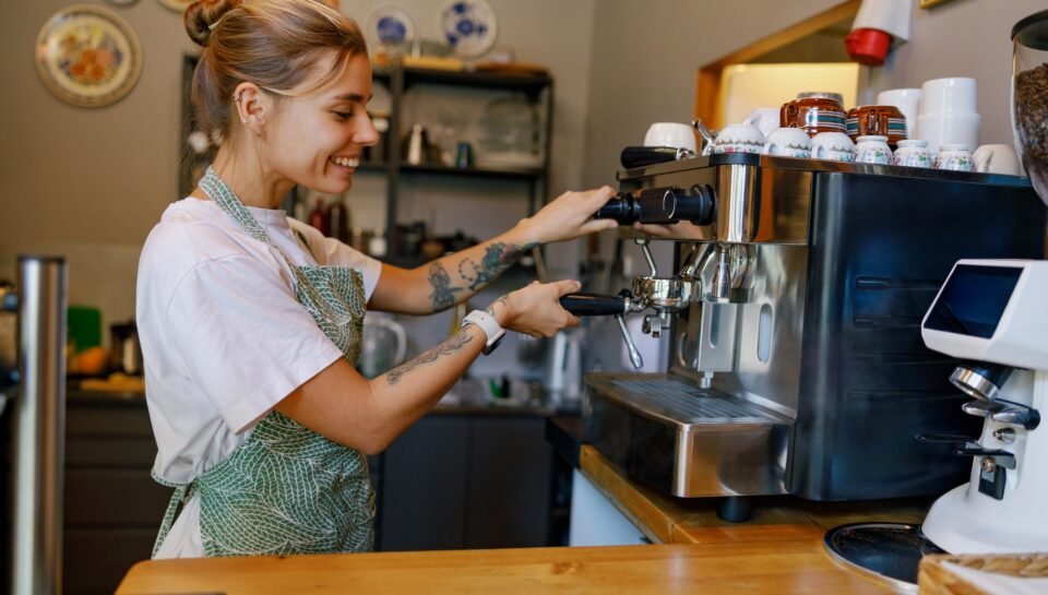 Barista at Work Skillfully Crafting the Perfect Coffee Experience in a Warm, Cozy Cafe Barista at Work Skillfully Crafting the Perfect Coffee Experience in a Warm, Cozy Cafe
